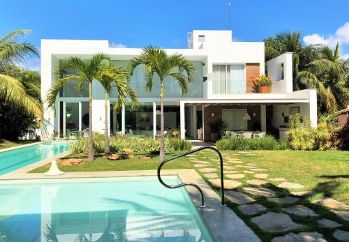 Casa de Praia em Interlagos - 4 suítes a poucos metros do mar