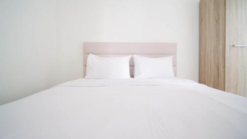 Compact and Tidy Studio at Puncak Dharmahusada Apartment By Travelio