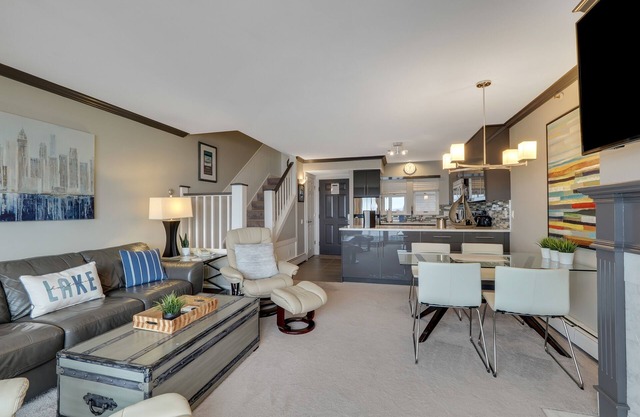 Condo with Lake Charlevoix Views | Private Beach Access | Gas Log Fireplace