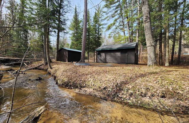 Cozy cabin with backyard stream close to Au Sable River and the best ATV trails