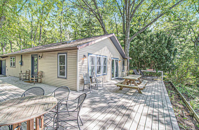 Cozy, lakefront cabin with gas grill and wrap-around deck.