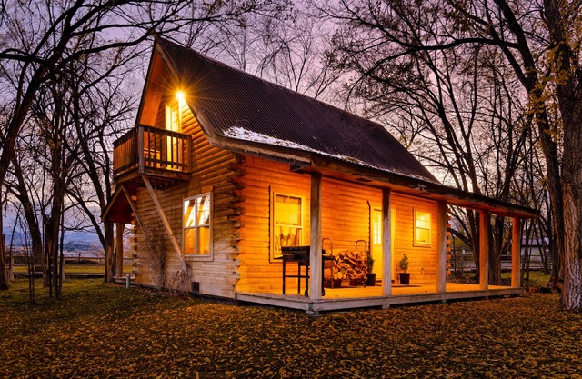 Cozy Log Cabin located on scenic acreage with trees and privacy.