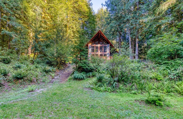 Creekside home with hot tub, deck, & great woodland views