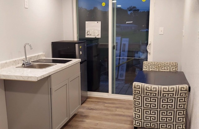 Custom Container Home w/ walk-in shower and patio! Walking distance to the river