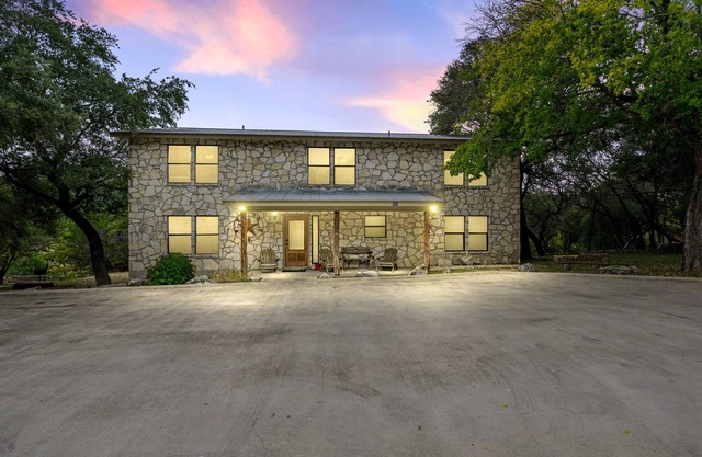 Directly ON the Frio River with exclusive river frontage, shuffleboard table & room for 25 guests