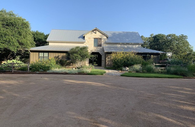 Dog-Trot Home on secluded acreage with pool and game room.