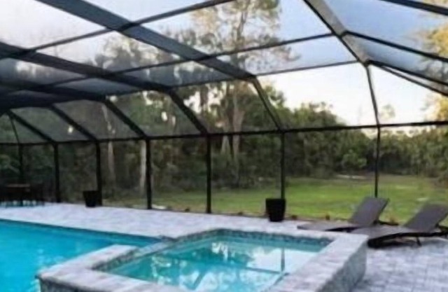 Enjoy this private home on a private 2-acre lot surrounded by beautiful gardens.