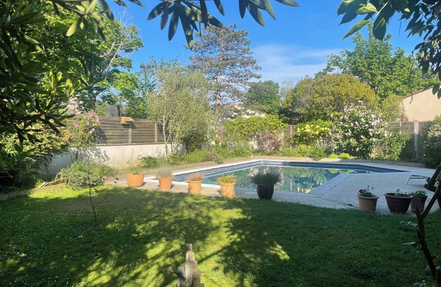 Family house with swimming pool in charming village