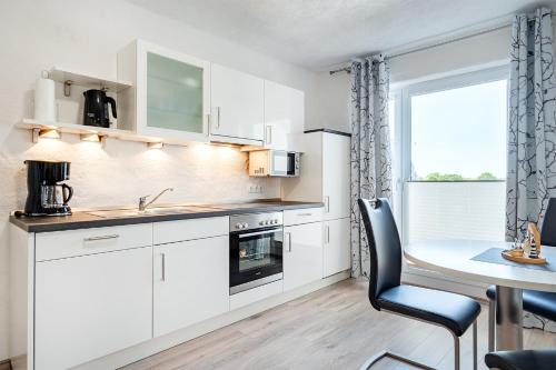 Ferienwohnung Flut mit Loggia und schönem Ausblick am Badesee Tannenhausen