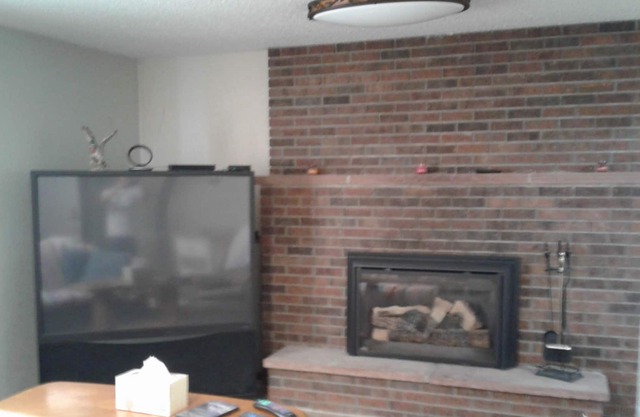 Furnished, all-inclusive studio with shared bath. Full Kitchen in unit.
