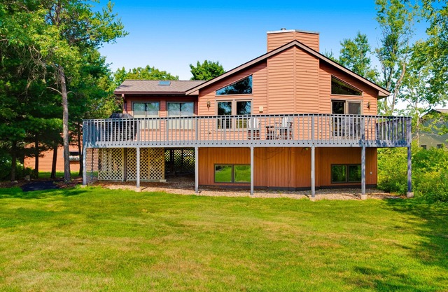 Golf course-front home with 2 pools, private beach, boat launches, tennis, grill