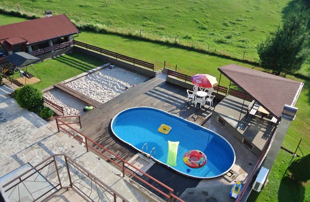 Holiday home with outdoor pool and lounge on the property
