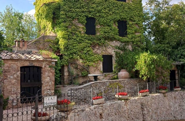 House with swimming pool is fenced garden