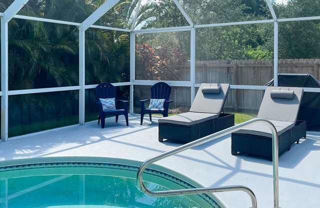Inviting home with yard, private pool, full kitchen, central AC, & W/D
