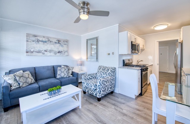 Lakefront corner condo with canoes, resort pool, tennis & firepit - dogs welcome