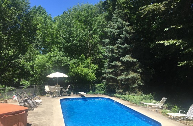 Large family home with private POOL and hot tub on heavily wooded lot