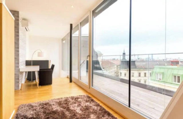 Luxurious Attic Apartments with Panoramic Views and Private Roof Terraces