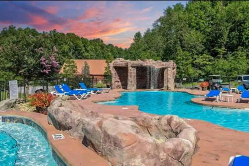 LUXURY 4BR Cabin in Gatlinburg with Views Hot Tub with Private Deck Game Room Most Popular Coffee Bar Perfect for Family Getaway Tennis Courts Infant Crib and Karaoke System