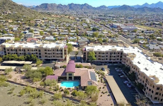 Luxury condo within resort-like gated community nestled against mountain reserve