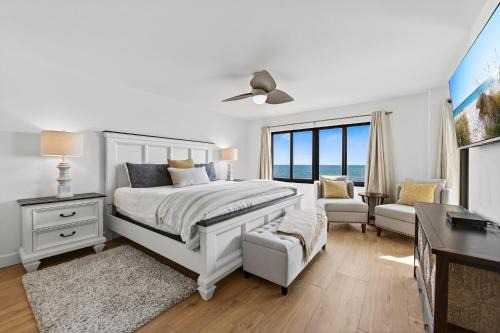 Luxury direct oceanfront corner with a large private balcony, heated pool and garage
