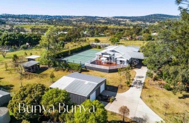 Luxury Estate set over 2 acres w/Tennis Court