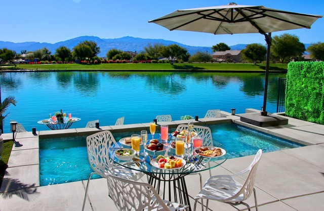 "Luxury Lakefront Paradise: Heated Pool Haven with Unrivaled Views"