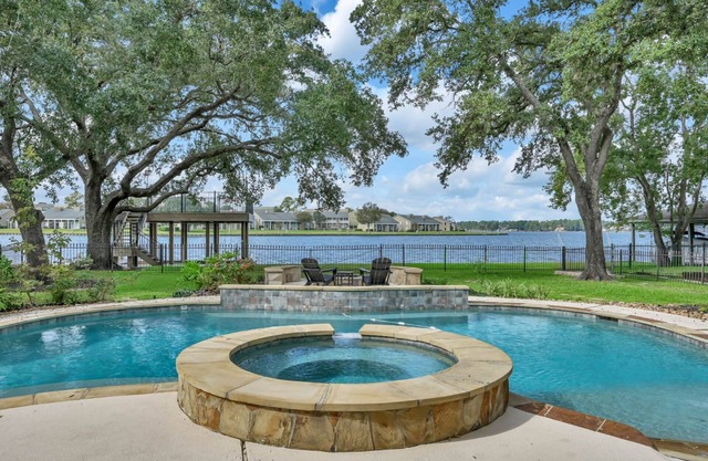 Luxury Waterfront Home with 2 Primary Suites, Pool, Spa, Boat Dock & Breathtaking Views!