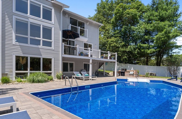 Modern coastal retreat w/pool, close to beaches and golf courses.