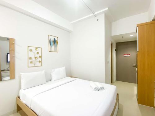 Modern Design Studio at Vasanta Innopark Apartment By Travelio