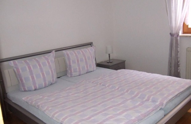 Modernly furnished 3-room apartment with terrace and small garden