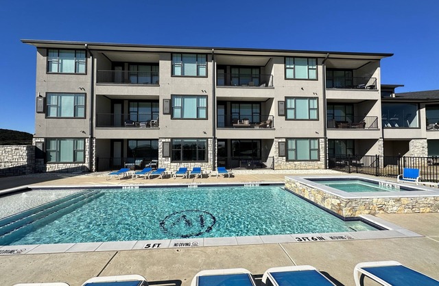 NEW! First Floor Pool side PK Lake Luxury Condo - Hot Tub, FirePit, Gym, Laundry