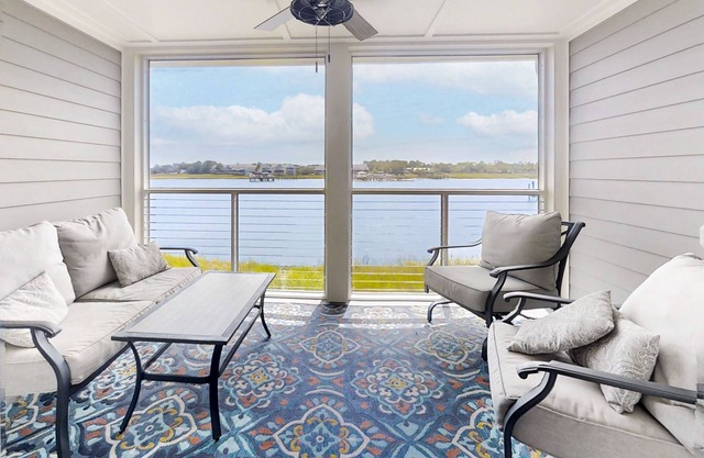 Newly renovated two-story waterfront condo with screened porch, pool, & tennis