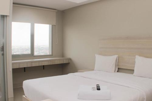 Nice Studio at Gateway Park LRT City Jatibening Apartment By Travelio