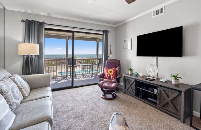 Oceanfront 2BR/2BA condo with balcony, pool, WiFi, & full kitchen. No pets/smoking