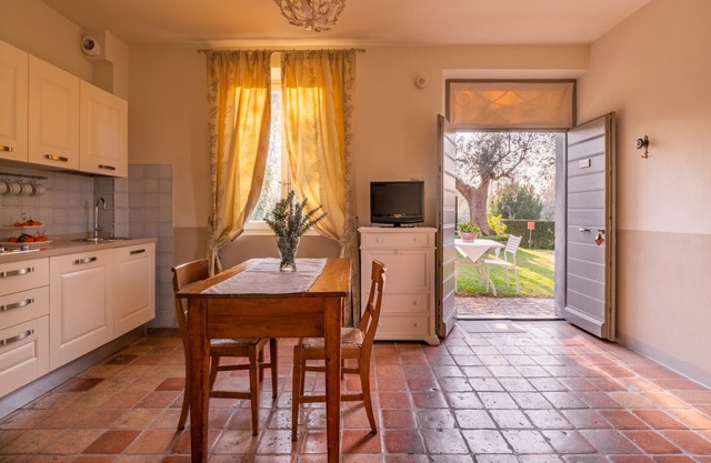 On the ground floor of an old farmhouse, in the countryside with a swimming pool