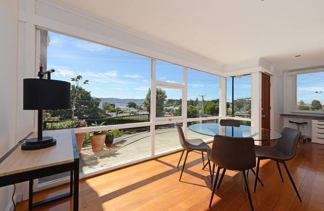 Panoramic water views, sunny and private - walk to beach, cafes and shops