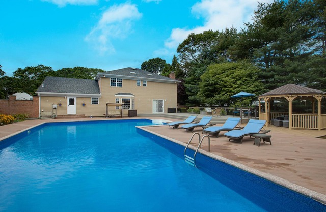 Peaceful Beach Retreat - Heated Pool, Big Backyard, Mini-Bar & Game Room