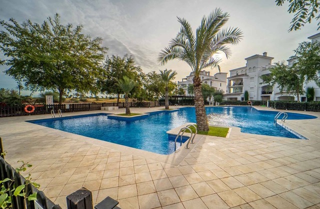 Perfectly located 2 bedroom ground floor golf course view poolside apartment