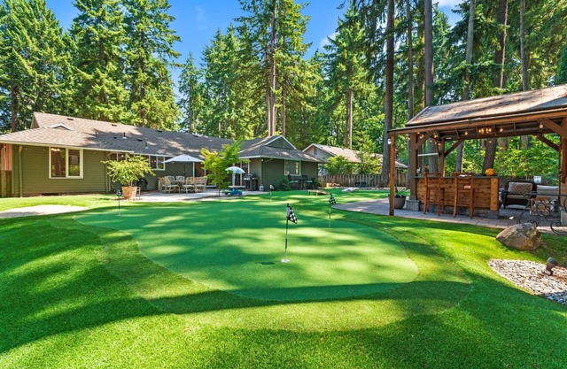 Phenomenal Single Level Home Featuring Incredible Outdoor Golf Option w/Gazebo, Fire-Pit, and Patio