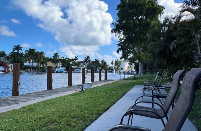 Poolside 2BR Retreat Canal Dock 6 minutes Walk to the Beach