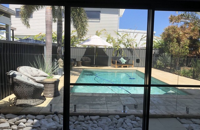 Poolside self contained unit walk to beach