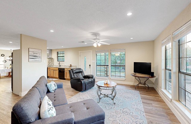 Private home with hill country views, open layout, W/D, central AC, & patio