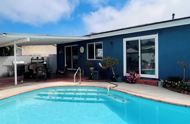 Relax at this Family Home w/Solar heated Pool & Game Room. Close to everything!