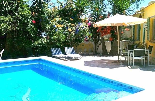 Relax by your private pool surrounded by garden or at beach only 300 meters .