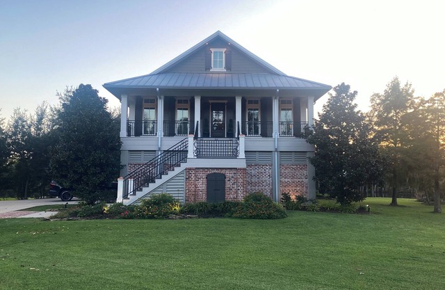 River front paradise with large dock and outdoor space, great for entertaining.