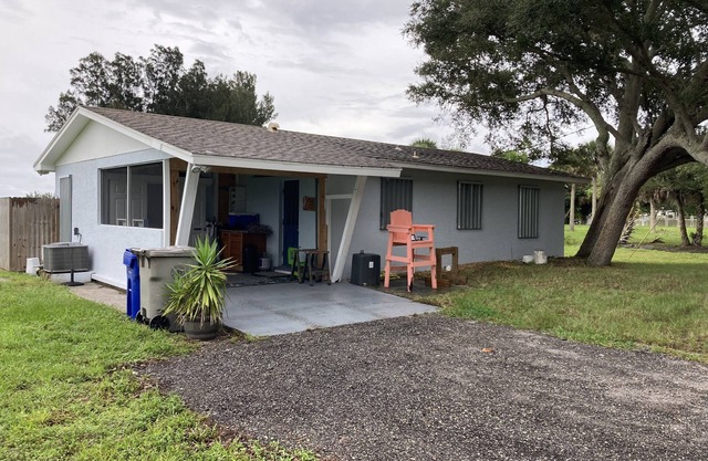 Riverfront home with a boat dock, WiFi, AC