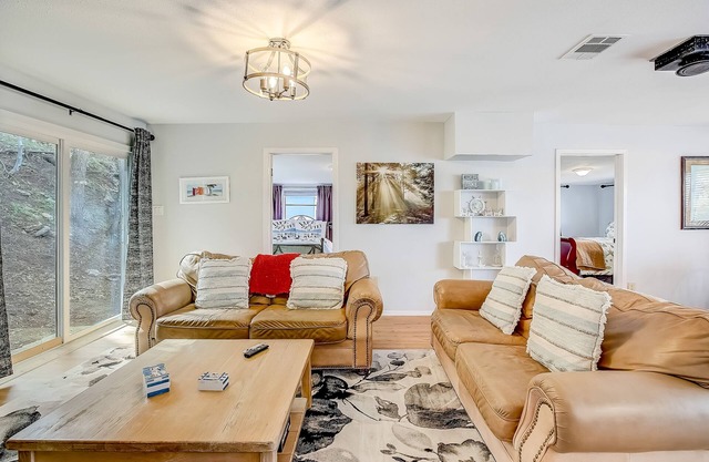 Riverside escape with a scenic deck, grill, firepit & central AC - dog-friendly