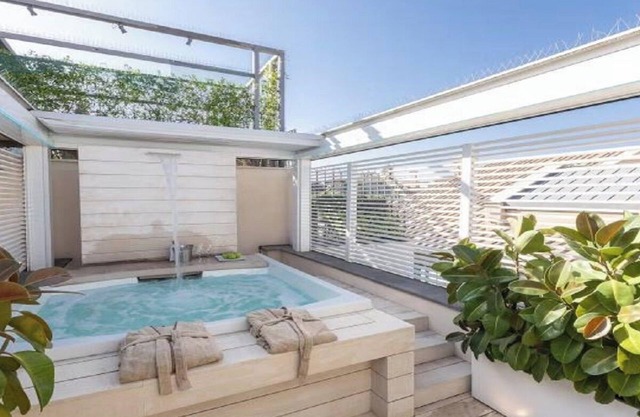 "Rome's Luxury Penthouse: Views, Jacuzzis, and Unbeatable Location"