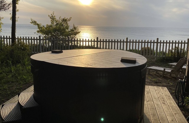 Secluded Charm on the Bluff: Sunset Views, Hot Tub & Stunning Lake Scenery!