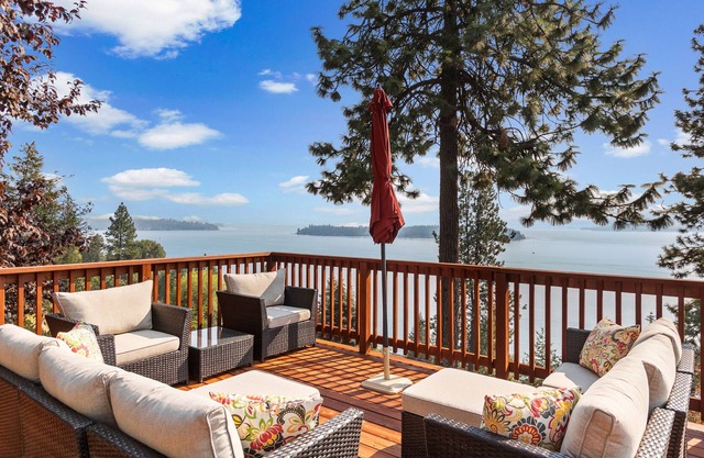 Serene lake-view retreat with deck, grill, firepit, & fireplace